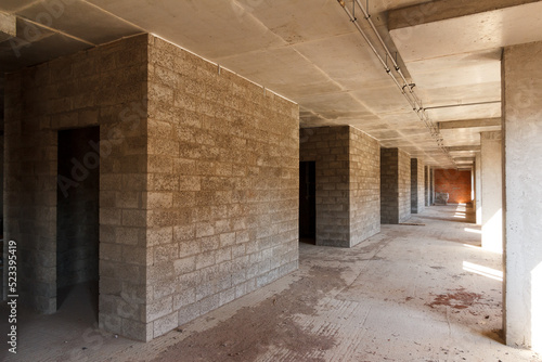 Inside the building under construction. Concrete walls of the new house