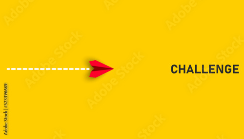 Paper airplane flying towards the challenge text. challenge idea concept. business life change concept.