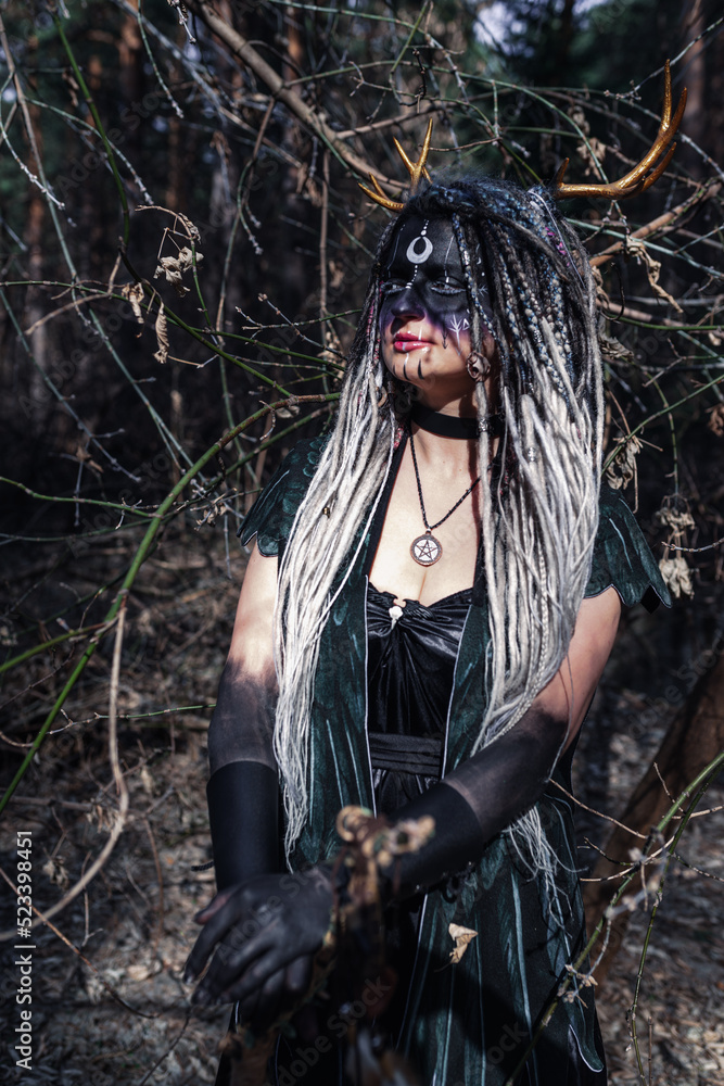 Naklejka premium Forest witch in a pine forest