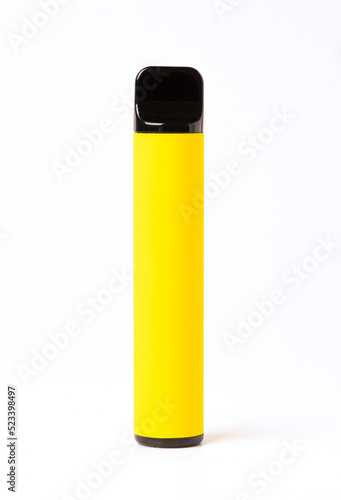 Yellow disposable electronic cigarette isolated on a white background. The concept of smoking, vaping and nicotine.