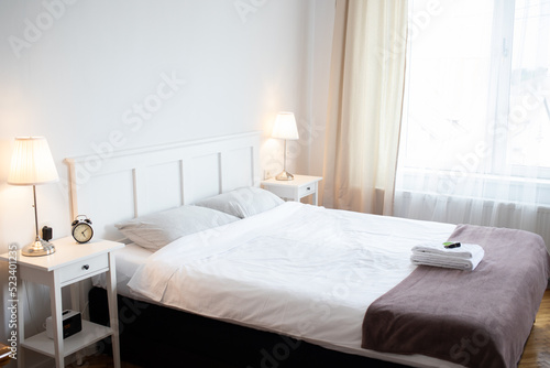 big bed in cozy white bedroom