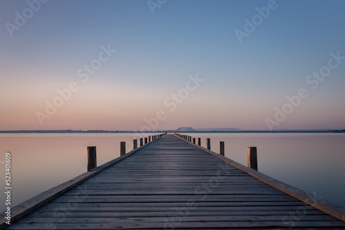 Fototapeta Naklejka Na Ścianę i Meble -  pier at sunrise with gorgeous colors