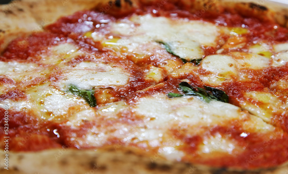 Neapolitan Italian pizza called margherita pizza. Pizza with Mozzarella cheese, Tomatoes, pepper, Spices and Fresh Basil. Italian pizza Neapolitan Italian pizza called margherita pizza. Pizza with Mozzarella cheese, Tomatoes, pepper, Spices and Fresh Basil. Italian pizza