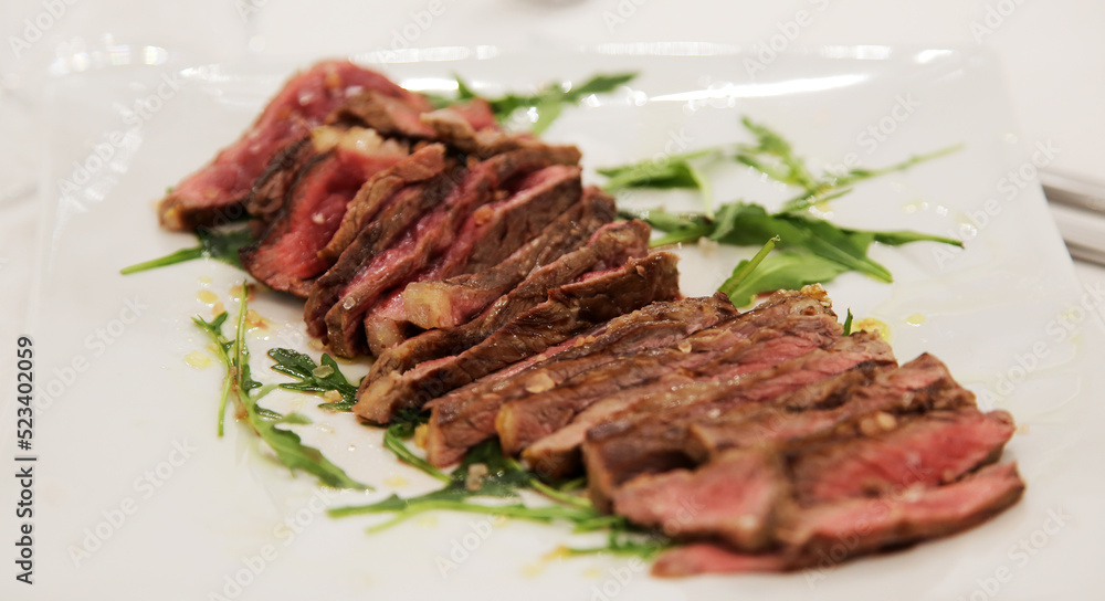 Roastbeef. Entrecote. Beef. Main courses: Fillet with rucola and extravirgin oil. Italian cuisine Roastbeef. Entrecote. Beef. Main courses: Fillet with rucola and extravirgin oil. Italian cuisine