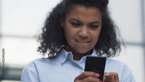 Thoughtful woman texting friend pose at office closeup. Online communication.