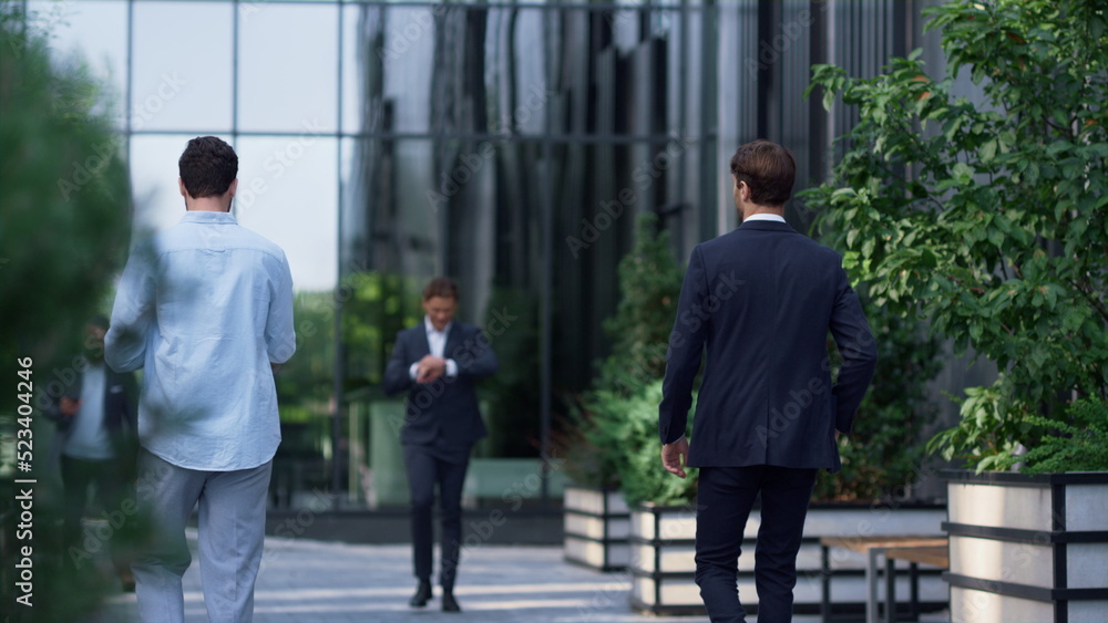 Diverse corporate people walking office building in suit. Businesspeople concept