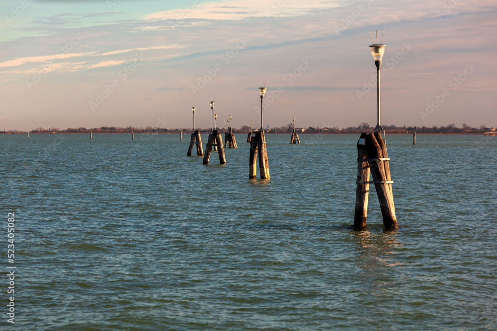 Typical wooden poles in a Venetian lagoon