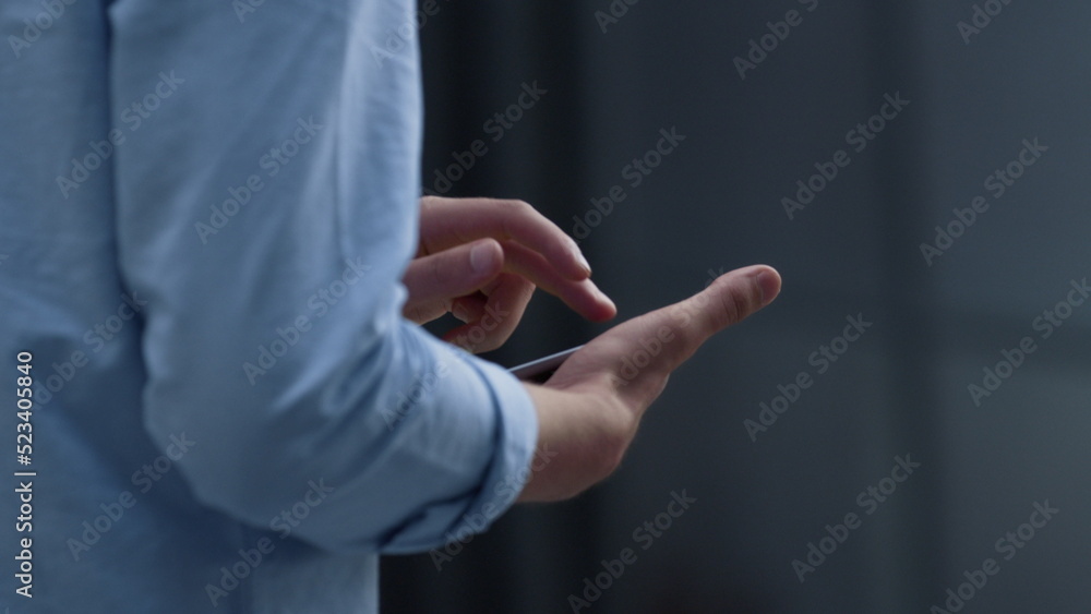 Businessman hands using tablet at downtown area closeup. Manager checking email.