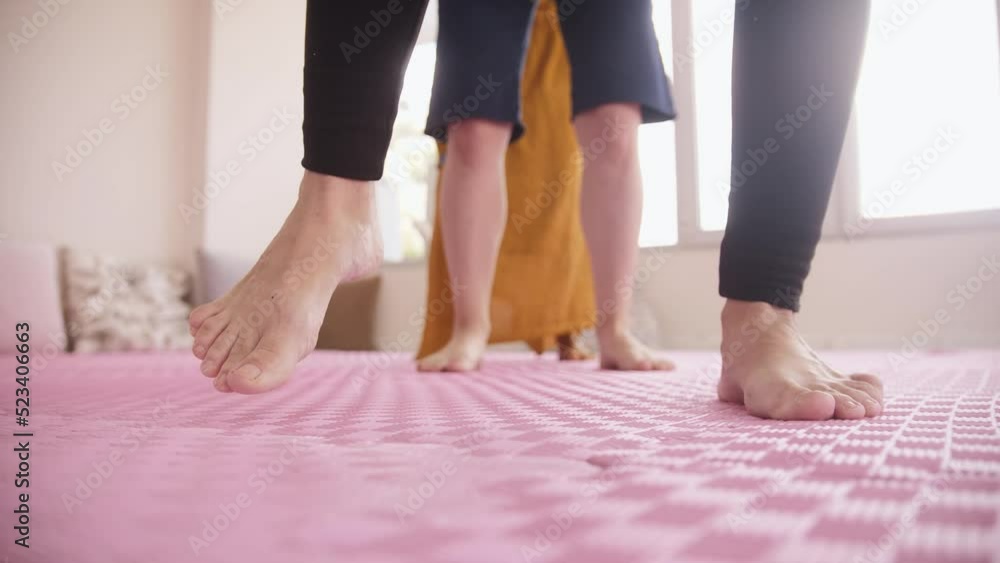 Women doing leg exercises while yoga class Women doing leg exercises while yoga class