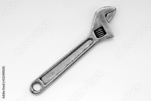 swedish type adjustable wrench made of tool steel isolated on white background closeup © Родион Бондаренко