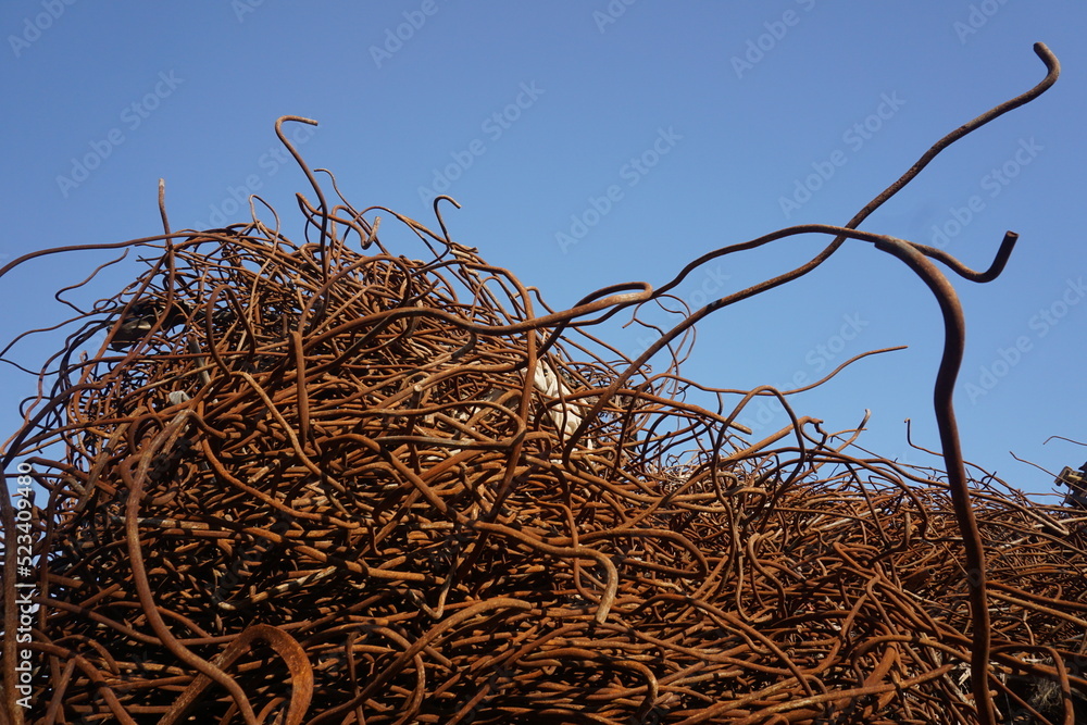 thin and rusted iron collected from demolished construction, rebar