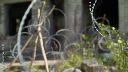 Ukraine war barbed wire. Destroyed Donetsk.
Barrage against military invasion.
Field military barrier, protection of civilians.