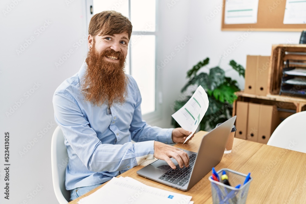 Young irish businessman smiling happy working at the office. Young irish businessman smiling happy working at the office.