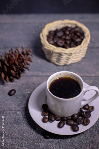 Fototapeta Naklejka Na Ścianę i Meble -  delicious black coffee on a glass cup with coffee beans