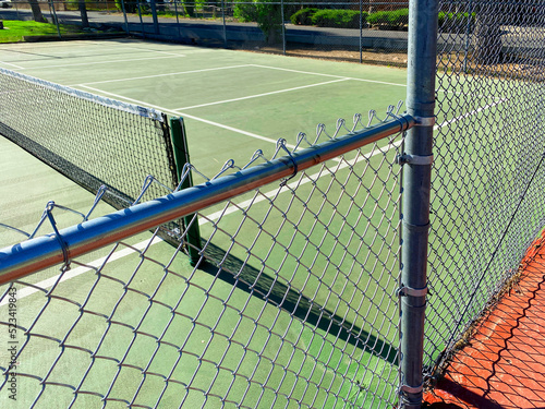 public park empty tennis court fence closed courts sports game play fun photo