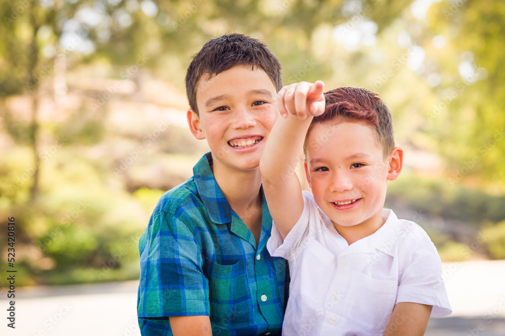 Outdoor portrait of mixed race Chinese and Caucasian brothers. Outdoor portrait of mixed race Chinese and Caucasian brothers.