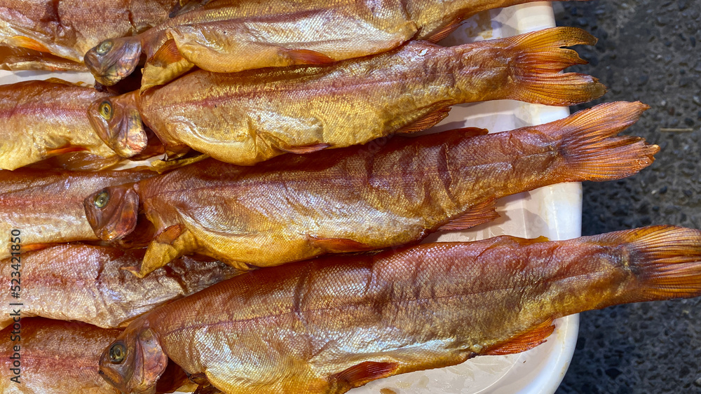 Natural background with smoked trout close-up Natural background with smoked trout close-up