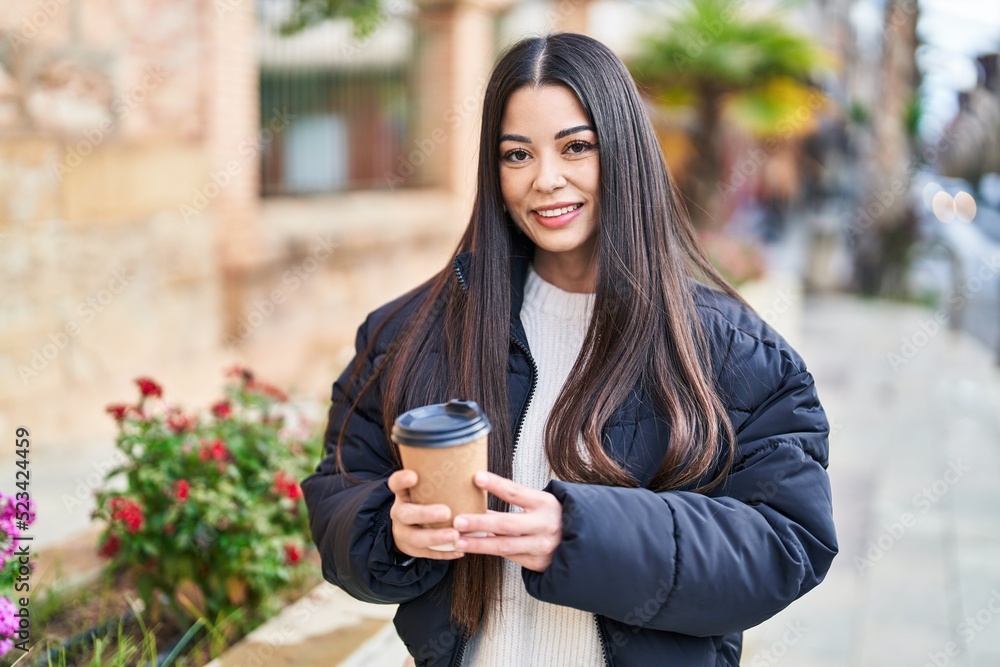 Young beautiful hispanic woman smiling confident drinking coffee at street Young beautiful hispanic woman smiling confident drinking coffee at street