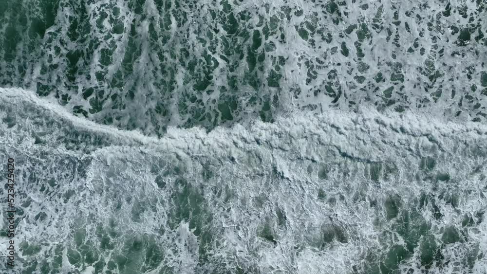 4K aerial shot from above wave crashing into shore 4K aerial shot from above wave crashing into shore