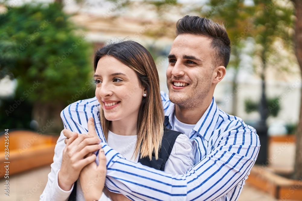 Man and woman couple smiling confident hugging each other at park Man and woman couple smiling confident hugging each other at park