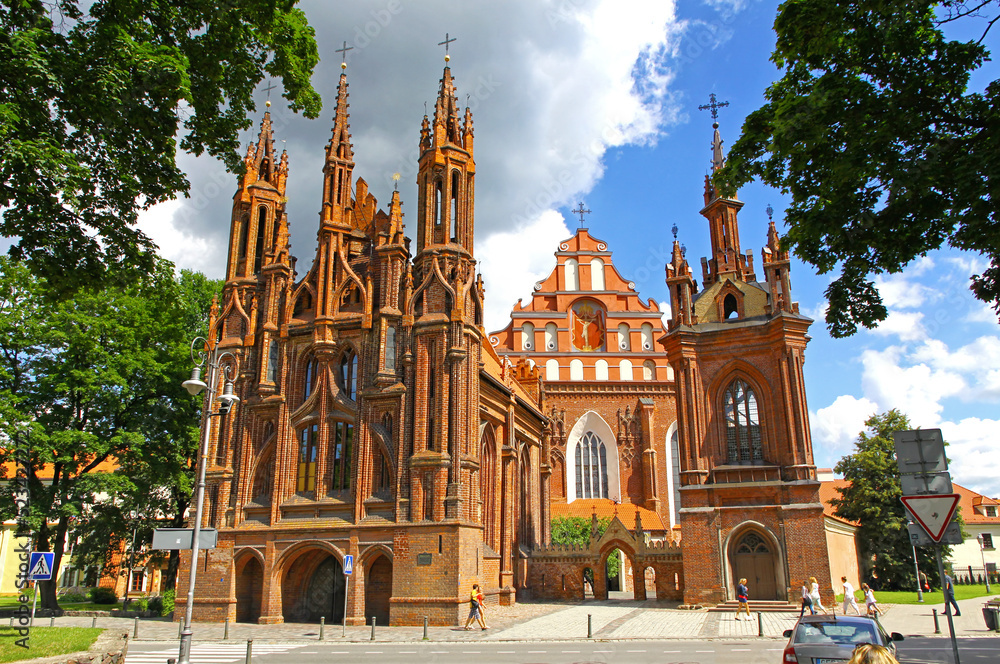 St. Anne's Church (Lithuanian: Sv. Onos baznycia) on fgnd and Church of St. Francis and St. Bernard (aka Bernardine Church) on bkgd. Famous Roman Catholic churches in Vilnius Old Town, Lithuania
