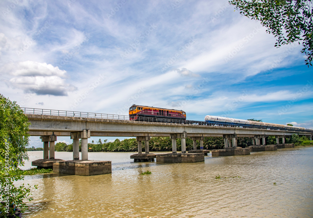Chachoengsao Thailand 9th Jun 2022: A train pass through the bridge on Bang Pakong River, it is a river in east Thailand. 