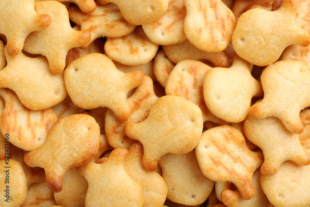 Delicious goldfish crackers as background, closeup view Delicious goldfish crackers as background, closeup view
