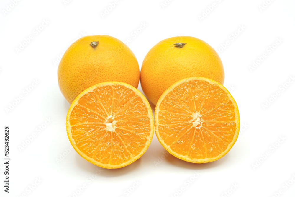 Halved oranges and two oranges look fresh appetizing on white background. Halved oranges and two oranges look fresh appetizing on white background.
