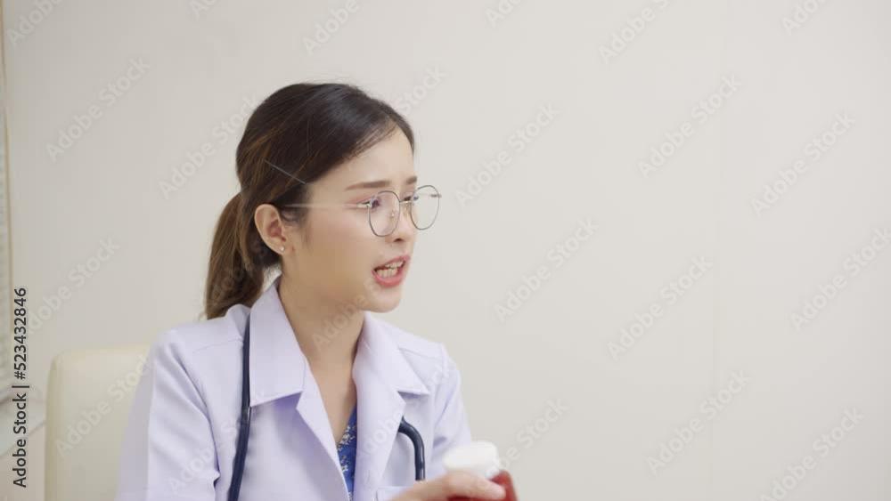 Asian female doctor having a consultation and advice medicine to a patient at the hospital. health protection, and healthcare and medicine concept Asian female doctor having a consultation and advice medicine to a patient at the hospital. health protection, and healthcare and medicine concept