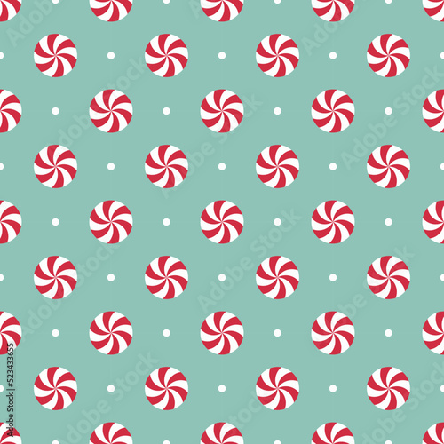 Seamless pattern with peppermint candies. Red and white mint candies on mint green background.