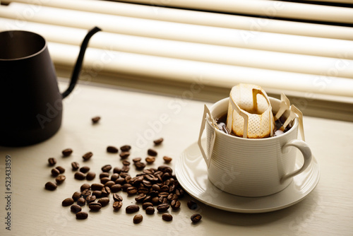 Coffee drip bag and coffee beans.