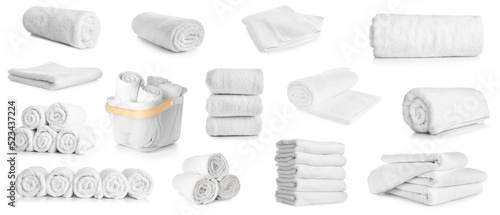 Set of clean soft towels isolated on white photo