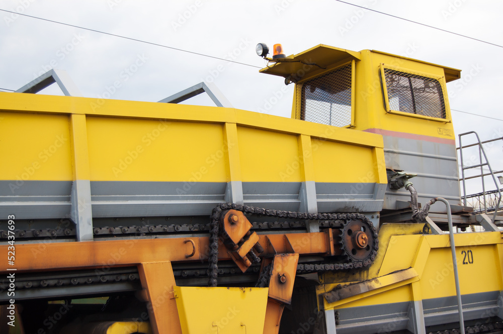 Railway wagons with heavy machinery on them Railway wagons with heavy machinery on them