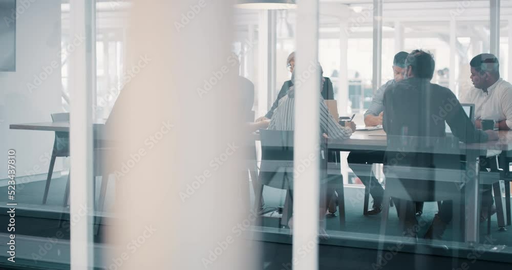 Businesspeople in a boardroom planning new global innovations in a diverse group office meeting together. Corporate executives having an international team discussion about their mission strategy