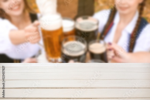 Empty wooden table and peop...