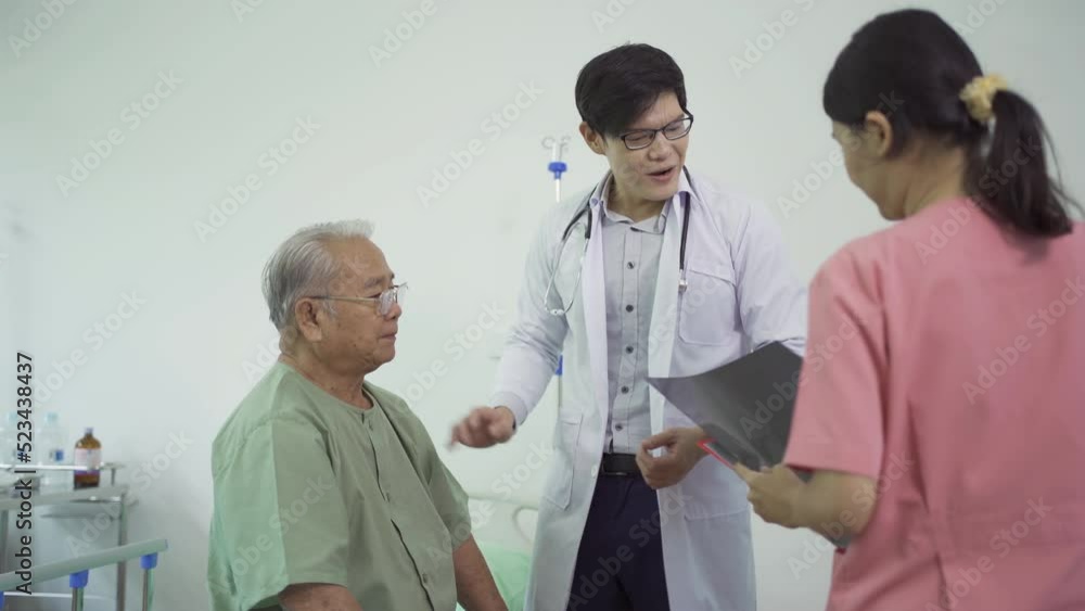 Portrait of Asian doctor showing bone x-ray scan film of sick old senior elderly patient on bed in hospital in medical and healthcare treatment at nursing home. People lifestyle Portrait of Asian doctor showing bone x-ray scan film of sick old senior elderly patient on bed in hospital in medical and healthcare treatment at nursing home. People lifestyle