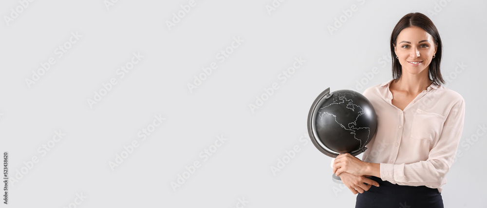 Fototapeta premium Female Geography teacher on light background with space for text