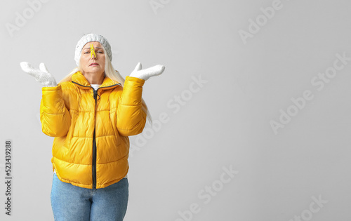 Ill mature woman with cloth...