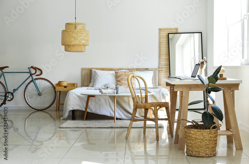 Interior of light bedroom w...