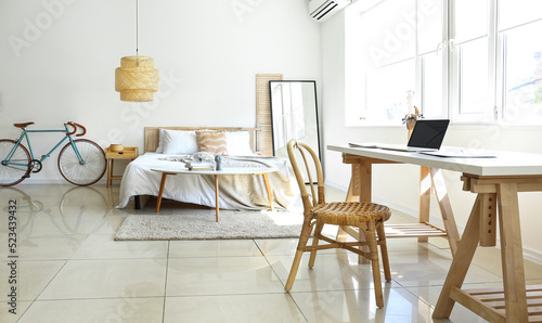 Interior of light bedroom w...