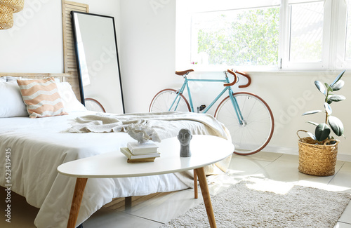Interior of light bedroom w...