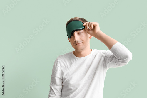 Young man with sleeping mas...