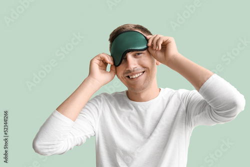 Young man with sleeping mas...