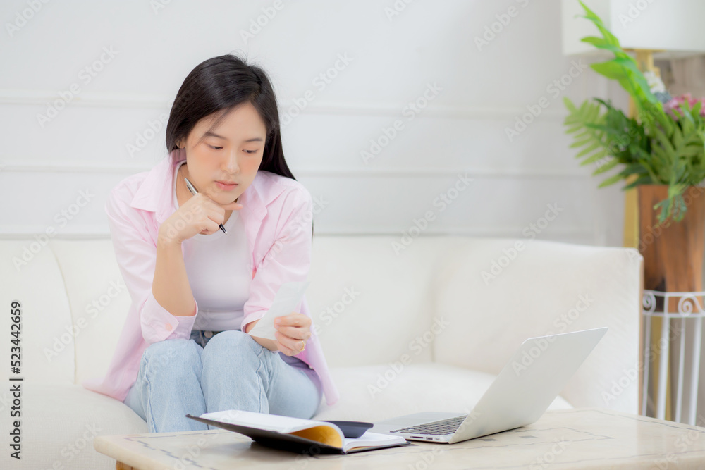 Young asian woman calculating expenses household about finance and frustrated at home, girl checking bill having stress and worried, debt and tax, expression and emotion tired, business concept. Young asian woman calculating expenses household about finance and frustrated at home, girl checking bill having stress and worried, debt and tax, expression and emotion tired, business concept.