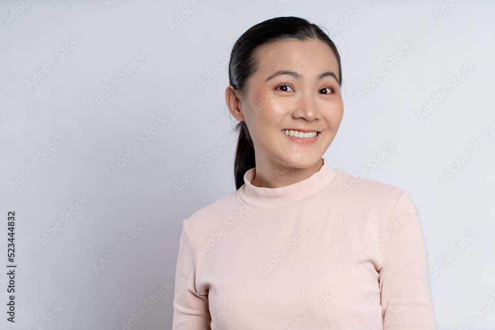 Asian woman happy smiling showing toothy smile. Asian woman happy smiling showing toothy smile.
