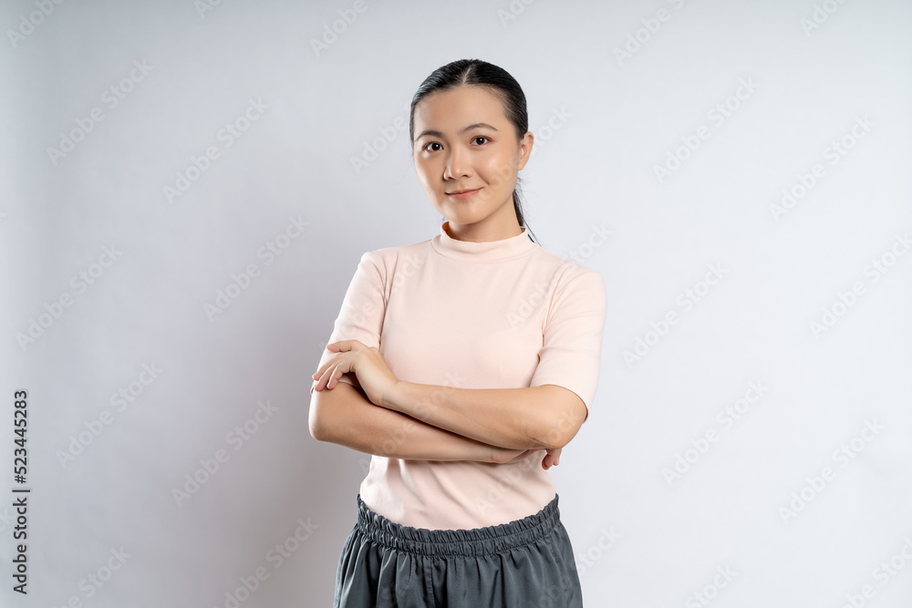 Asian woman happy confident standing crossed arms, looking at camera. Asian woman happy confident standing crossed arms, looking at camera.