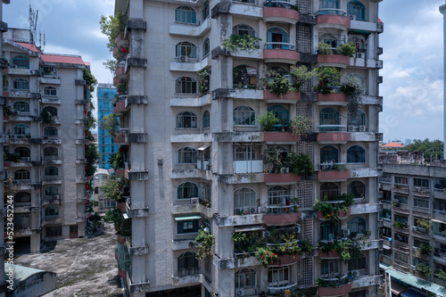 Old communist ,brutalist apartment building in Cho lon  or Chinatown district of Ho Chi Minh City, Vietnam. Mid height aerial view photo