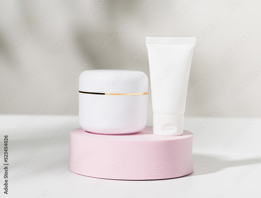 White cosmetic bottle on podium, ingredients for skin care and treatment vitamin, packaging product for mockup. White cosmetic bottle on podium, ingredients for skin care and treatment vitamin, packaging product for mockup.