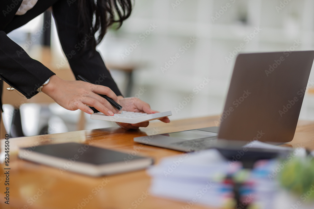 Business Asian woman working with laptop computer and calculator document on an office desk, doing planning analyzing the financial report, business plan investment, finance analysis concept.
Business Asian woman working with laptop computer and calculator document on an office desk, doing planning analyzing the financial report, business plan investment, finance analysis concept.