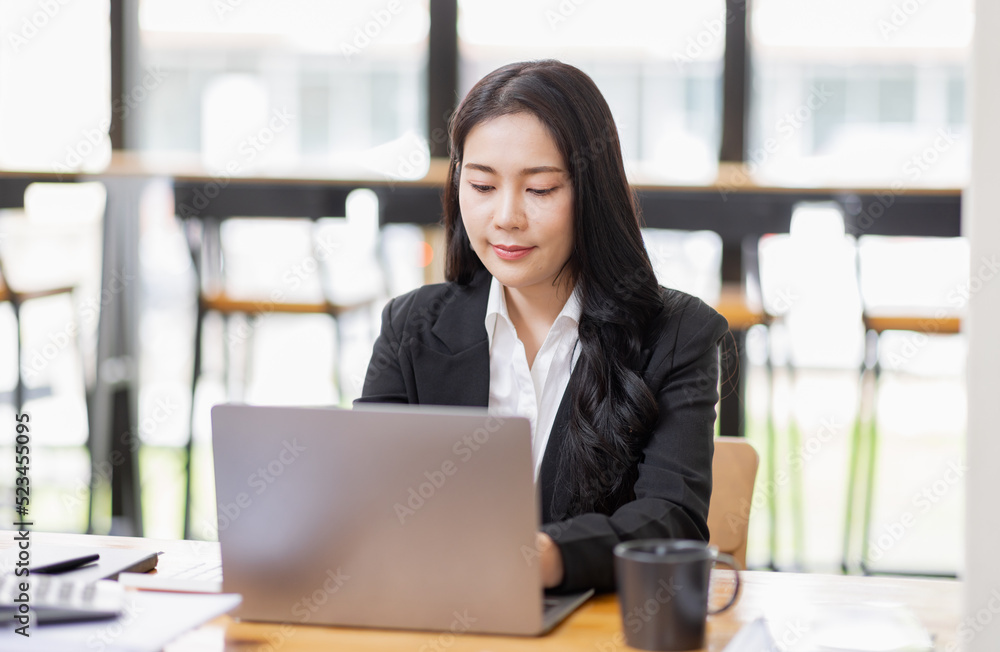 Business Asian woman working with laptop computer and calculator document on an office desk, doing planning analyzing the financial report, business plan investment, finance analysis concept.
Business Asian woman working with laptop computer and calculator document on an office desk, doing planning analyzing the financial report, business plan investment, finance analysis concept.